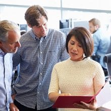 Coworkers reviewing documents