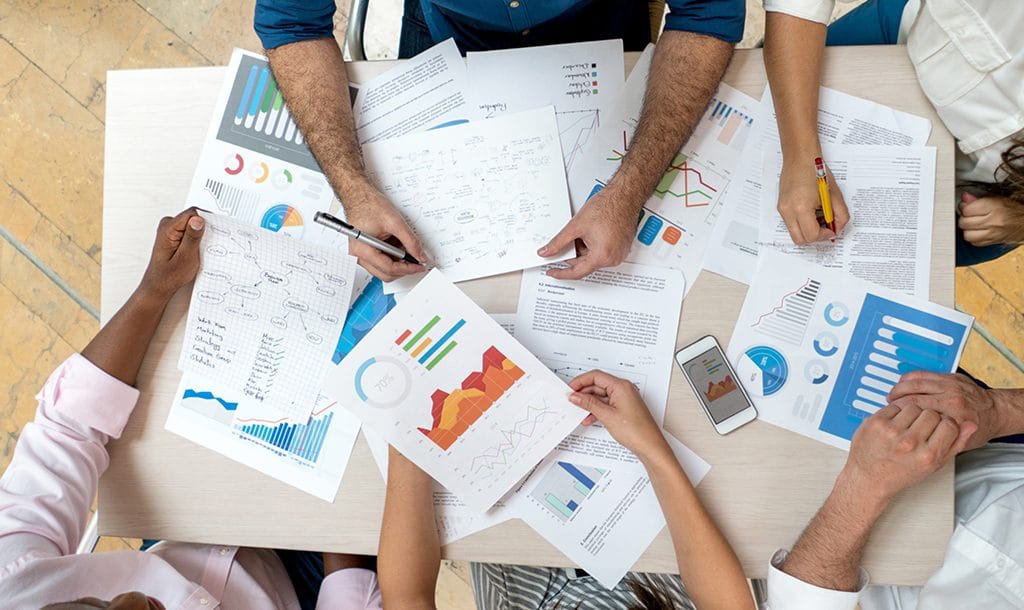 Group reviewing charts